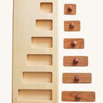Wooden Story Montessori Long-Short wooden Knob Puzzle Toy. A wooden puzzle including a base frame and 5 rectangular shaped pieces in different lengths with round wooden knobs.  The rectangular pieces are shown out of the frame. 