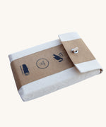 The canvas style bag that the Wooden Story Montessori Sand Tray set come in shown on a plain background.