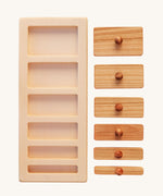 The Wooden Story Montessori Wide-Thin Knob Puzzle. A puzzle with 5 rectangular shaped pieces that fit into a wooden frame.