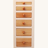 The Wooden Story Montessori Wide-Thin Knob Puzzle. A puzzle with 5 rectangular shaped pieces that fit into a wooden frame.