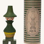 Wooden Story Stacking Toy Stick Figure - No7 next to its decorative cardboard tube with a wooden lid.