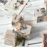 Three blocks from the Wooden Story Melliferous Plants Puzzle Block set placed on top of the matching card. 