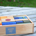 Wooden Story Rainbow XL Blocks set in a tray. The set contains 63 blocks of various shapes and sizes.