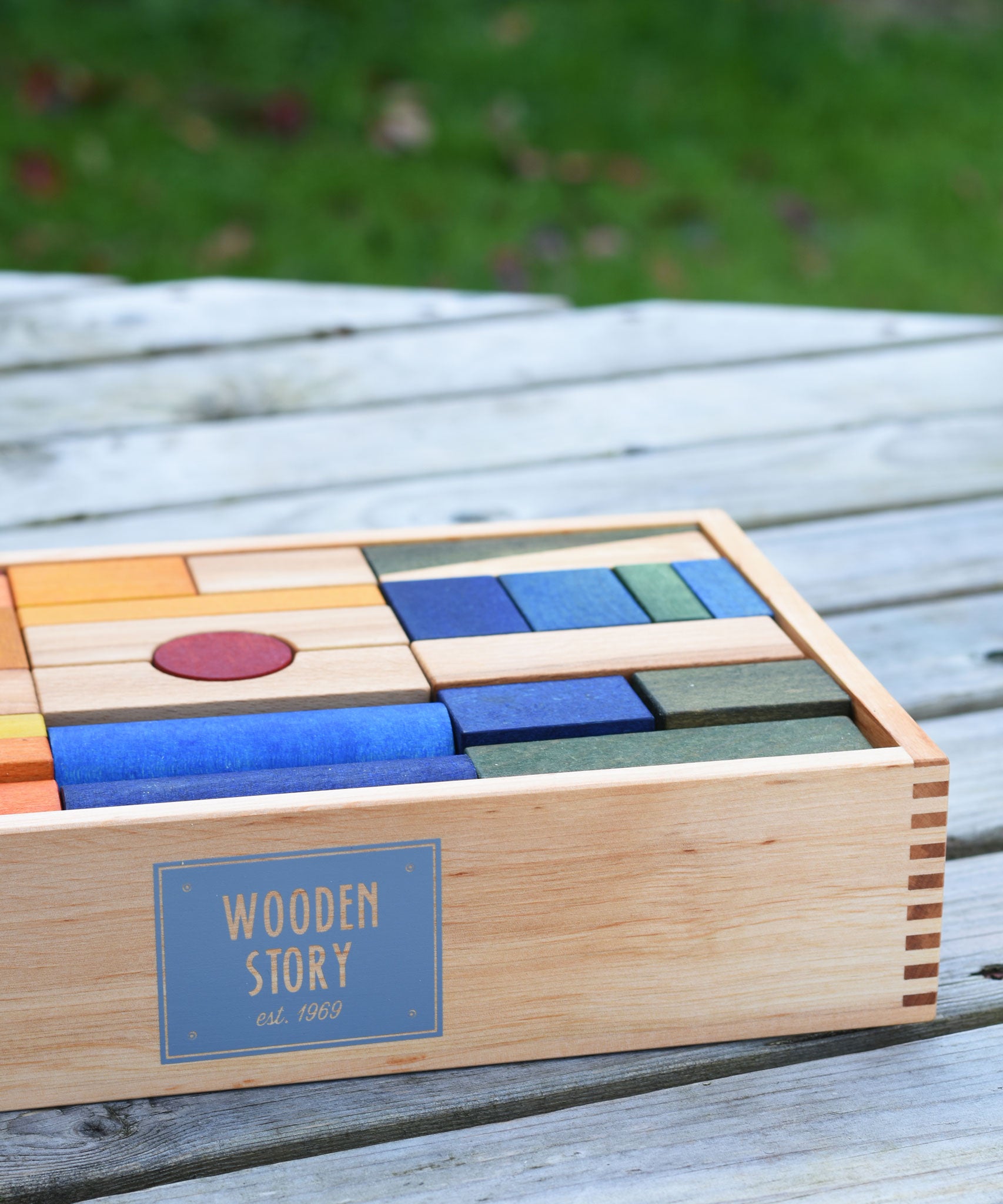 Wooden Story Rainbow XL Blocks set in a tray. The set contains 63 blocks of various shapes and sizes.