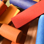 A close up of some of the blocks included in the Wooden Story Rainbow XL Blocks set.