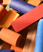 A close up of some of the blocks included in the Wooden Story Rainbow XL Blocks set.