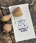 Wooden Story Traditional Style Swing N' Catch cup and ball Toy with a cotton drawstring storage bag.