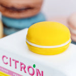 A closeup picture of the large yellow macaron on the roof of the Candylab Candyvan Citron truck.