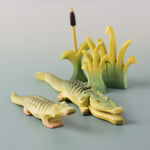 Bumbu's Wooden Reed's in small and large, in a scene with Bumbu's Crocodile, Baby Crocodile and Cattails.