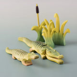 Bumbu's Wooden Reed's in small and large, in a scene with Bumbu's Crocodile, Baby Crocodile and Cattails.