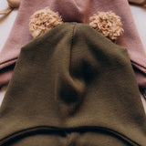 A close up of the Wooly Organic hat with teddy ears in tea leaf / savannah available at Babipur a ribbed style hat showing the cute fluffy teddy bear ears detail 