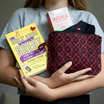 All items from the WUKA First Period Pack being held in arms