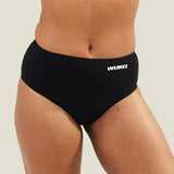 Close-up of WUKA Seamless Midi Brief period underwear worn by a model, showing the smooth fabric finish and full coverage designed for leak-proof protection.