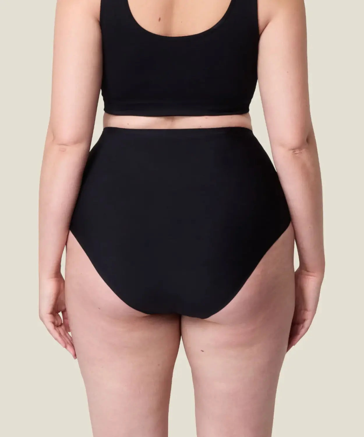 Back of woman wearing the Wuka stretch seamless high waisted period pants 