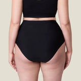 Back of woman wearing the Wuka stretch seamless high waisted period pants 