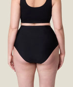 Back of woman wearing the Wuka stretch seamless high waisted period pants 