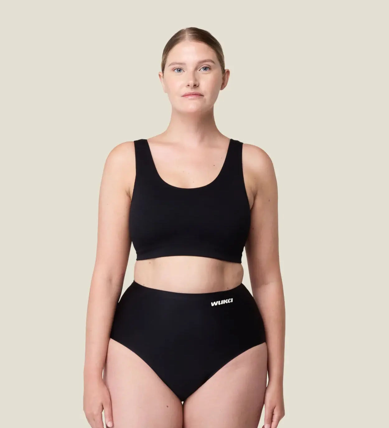 Front of woman wearing the Wuka stretch seamless high waisted period pants 