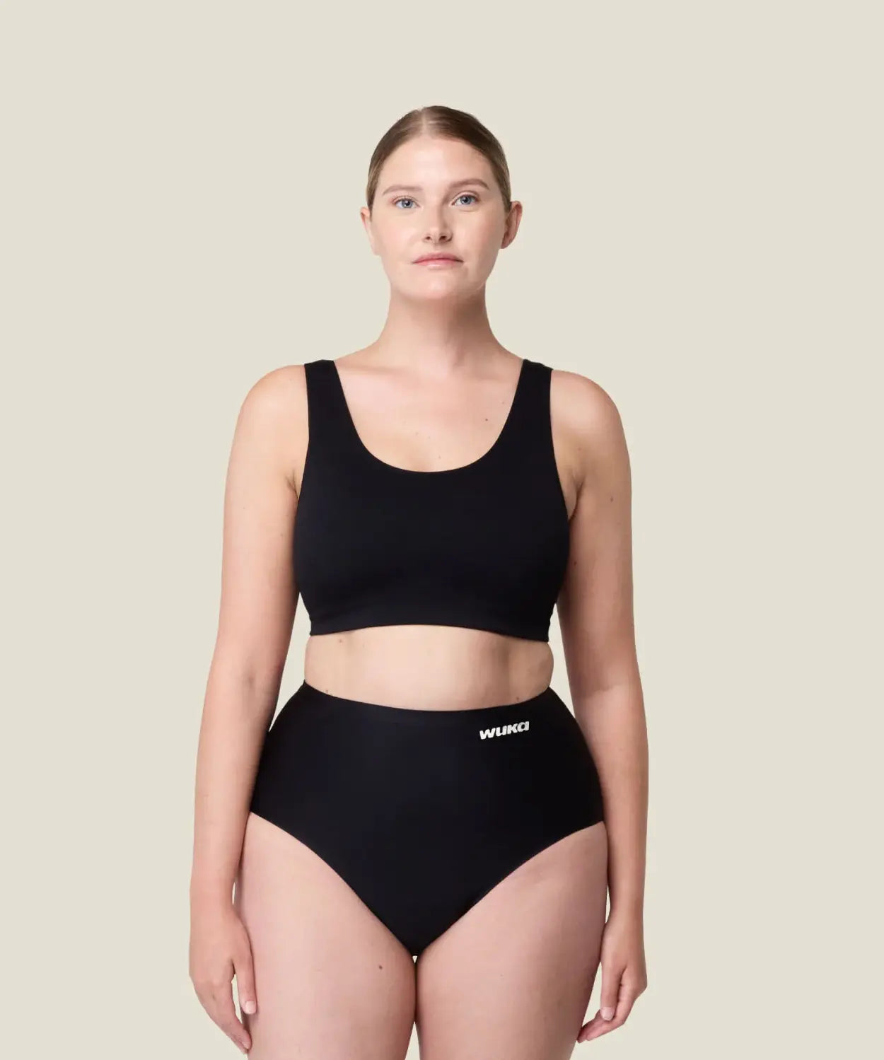 Front of woman wearing the Wuka stretch seamless high waisted period pants 