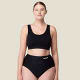 Front of woman wearing the Wuka stretch seamless high waisted period pants 