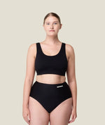 Front of woman wearing the Wuka stretch seamless high waisted period pants 