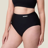 Side of woman wearing the Wuka stretch seamless high waisted period pants 