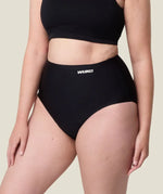 Side of woman wearing the Wuka stretch seamless high waisted period pants 