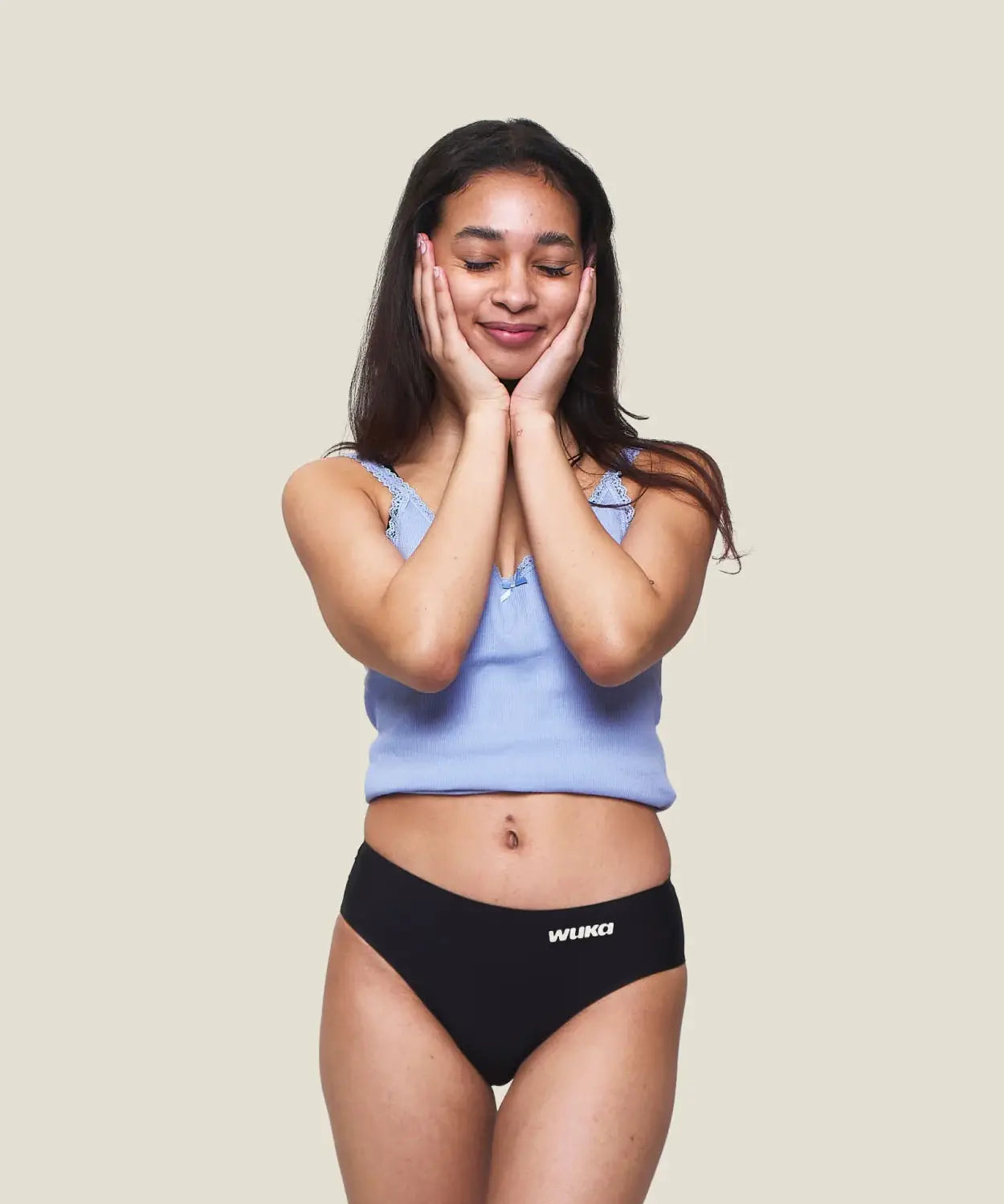 Front of teen wearing the WUKA Teen Stretch Bikini Brief Period Pants 