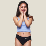 Front of teen wearing the WUKA Teen Stretch Bikini Brief Period Pants 