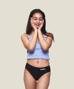 Front of teen wearing the WUKA Teen Stretch Bikini Brief Period Pants 
