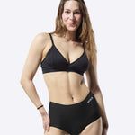 A person stretching the material on the WUKA Stretch Boxer Shorts Heavy Flow - Black