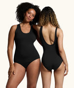 Two women wearing the WUKA Scoop Back Period Swimsuit. One showing the front of the swimsuit and the other showing the scoop back
