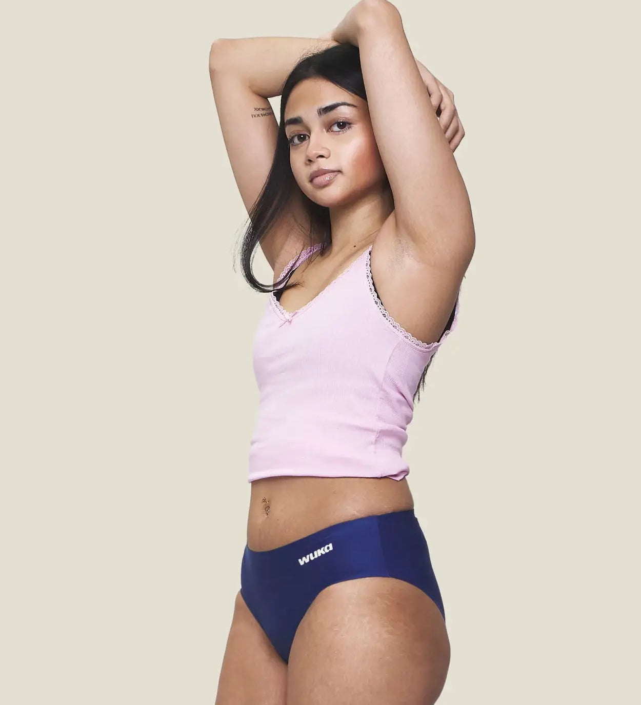 Front of model wearing the Wuka stretch teen midi brief seamless period pants in blue