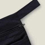 Wuka two pocket changing bag in black showing close up of zipper and carry loop detail