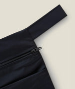 Wuka two pocket changing bag in black showing close up of zipper and carry loop detail