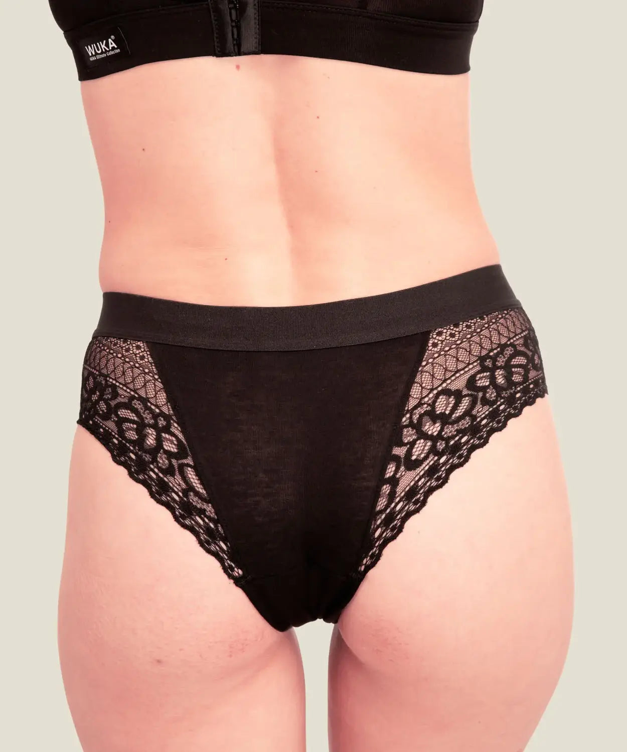 Back of woman wearing the Wuka ultimate lace midi medium flow period pants