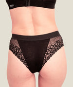 Back of woman wearing the Wuka ultimate lace midi medium flow period pants