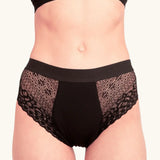 Front of woman wearing the Wuka ultimate lace midi medium flow period pants