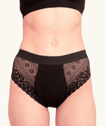 Front of woman wearing the Wuka ultimate lace midi medium flow period pants