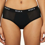 Front of woman wearing the WUKA reusable ultimate midi brief period pants 
