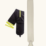 Wuka wearable hot water bottle to relieve period pains. A rubber bottle with a soft black fleece sleeve