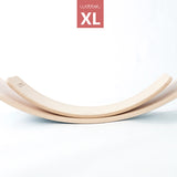 Wobbel XL Beech Wood balance board underneath a Wobbel Original board on a white background