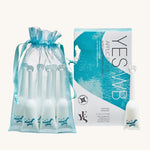 Yes Organic Water-Based Lubricant - 6 Pack Applicator, in a light blue mesh bag and the box next to it