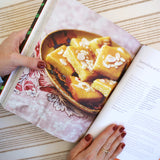 The Zaitoun Palestinian recipe book, opened to reveal a page with a recipe for a semolina dessert.