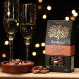 Zaytoun Fairtrade Palestinian caramelised Almonds in the box picured next to a bowl filled with the almonds. We are proud stockists of Zaytoun olive oil and produce here at Babipur. 