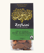 150g pack of Zaytoun raw almonds presented in a bag with a decorated black and green packaging